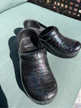 Dansko Black Clogs with Iridescent Purple-Green Accent